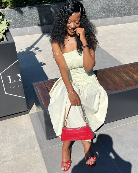 TM Beauty customer wearing a curly water-wave unit
